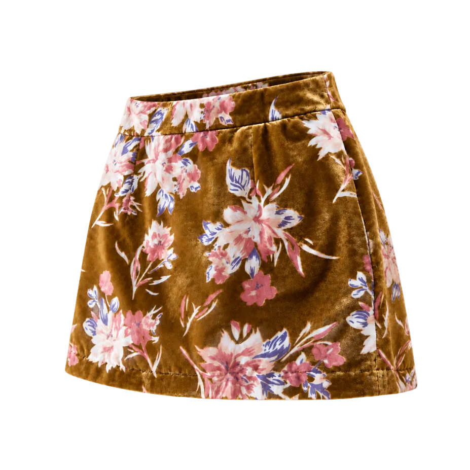 A high-waisted A-line mini skirt in brown velvet with a pink, white, and blue floral print, shown against a plain white background.