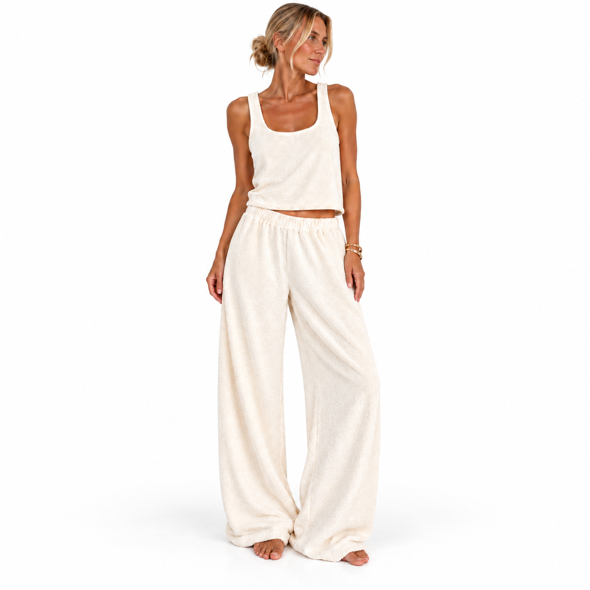 Front view of a model wearing the cream Towelling Loungewear Set, Long, by Hostess the label, with a cropped tank and full-length wide-leg pants.