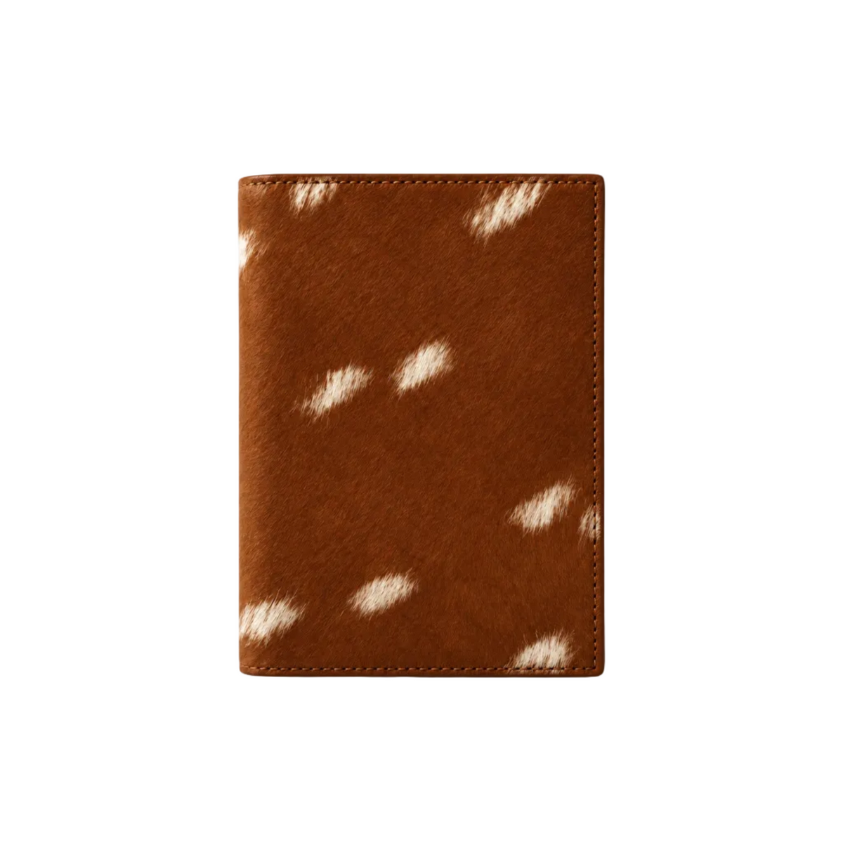 A brown leather passport cover or wallet featuring a white cowhide hair-on-hide spot pattern, shown on a clean white background with a soft drop shadow.